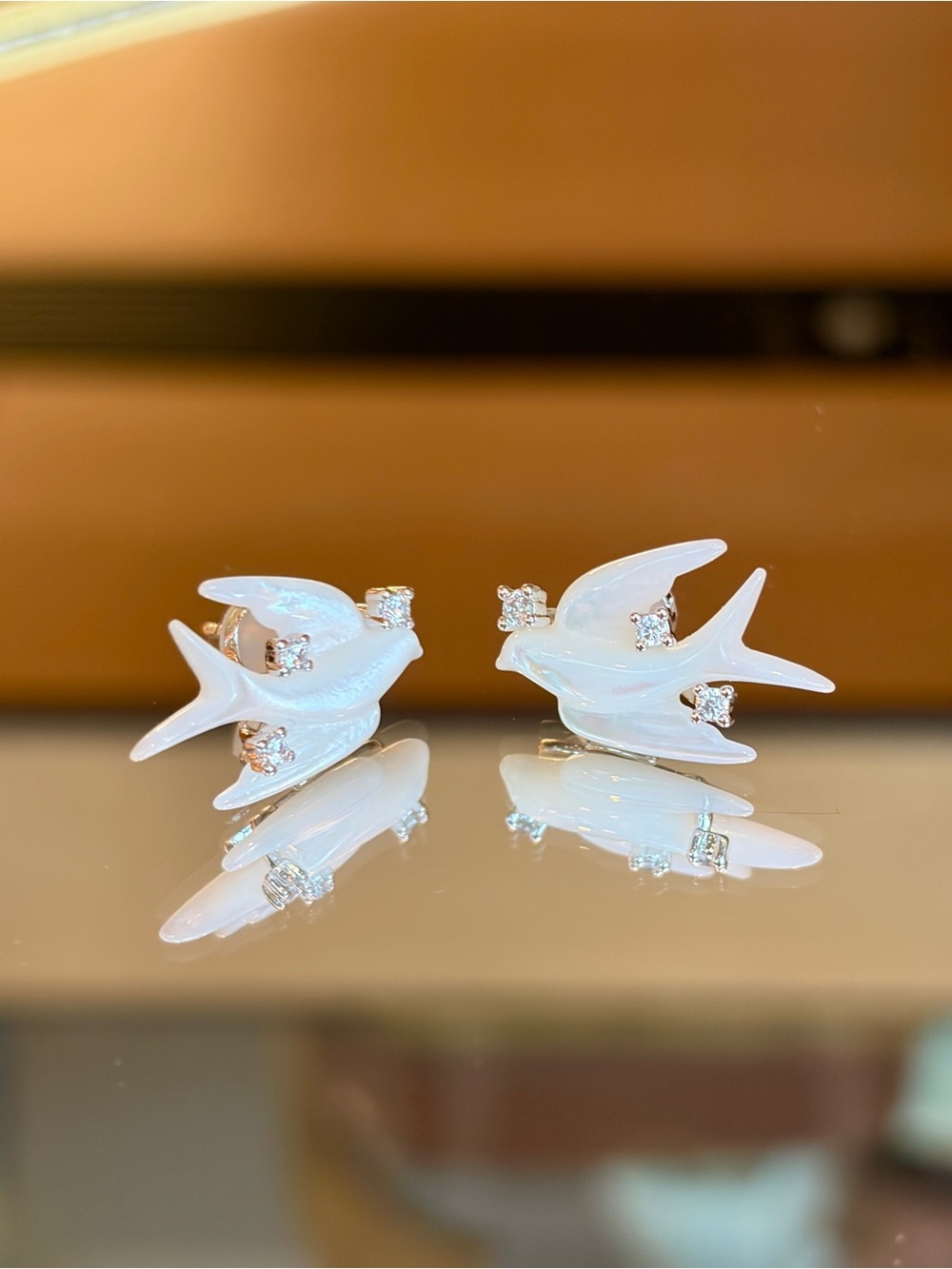 New S925 Sterling Silver Mother of Pearl Swallow Bird Earrings with Sparkling CZ